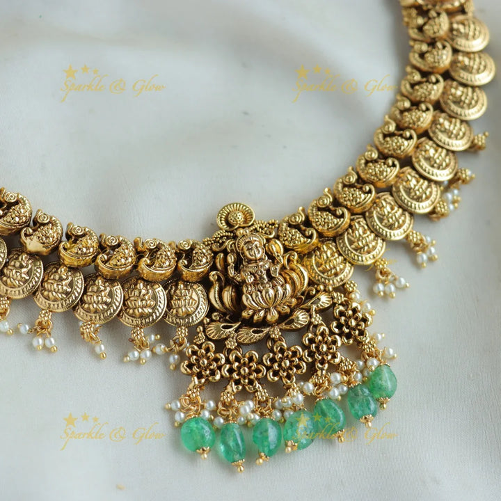 Stunning Lakshmi peacock carved coin short necklace with mint green beads - Sparkle and Glow