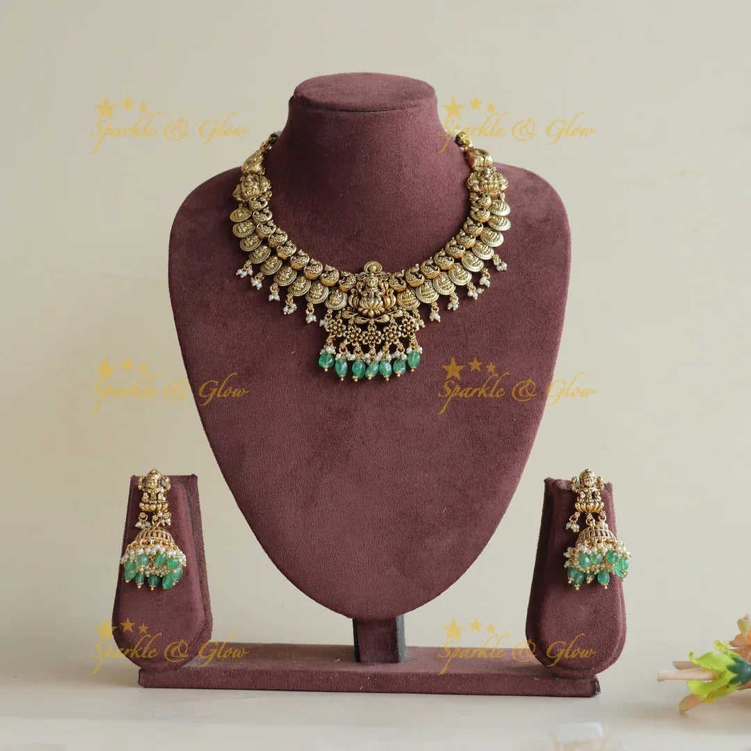 Stunning Lakshmi peacock carved coin short necklace with mint green beads - Sparkle and Glow