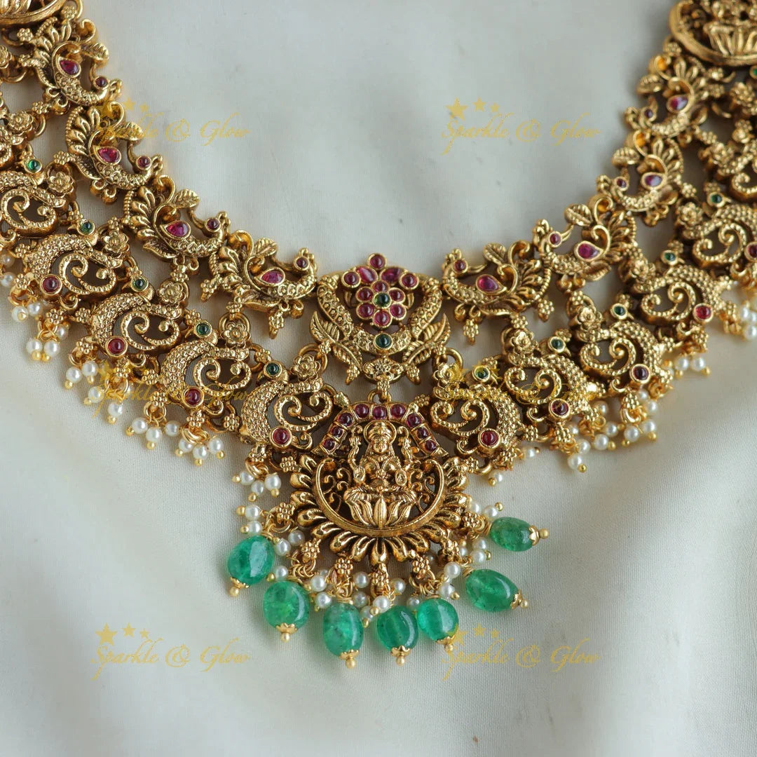 Grand Intricaate Lakshmi peacock carved short necklace with ruby emerald and mint green beads - Sparkle and Glow