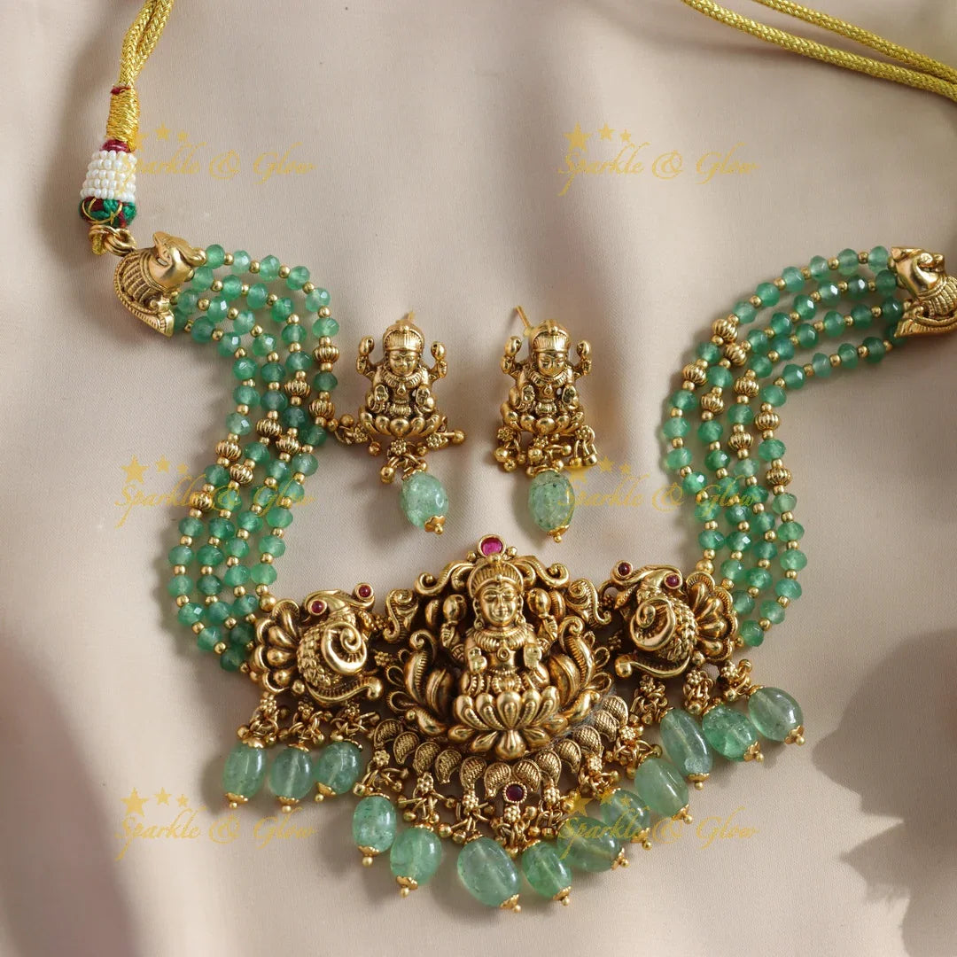 Beautiful Lakshmi Peacock carved choker with multi layer gold and mint green beads - Sparkle and Glow