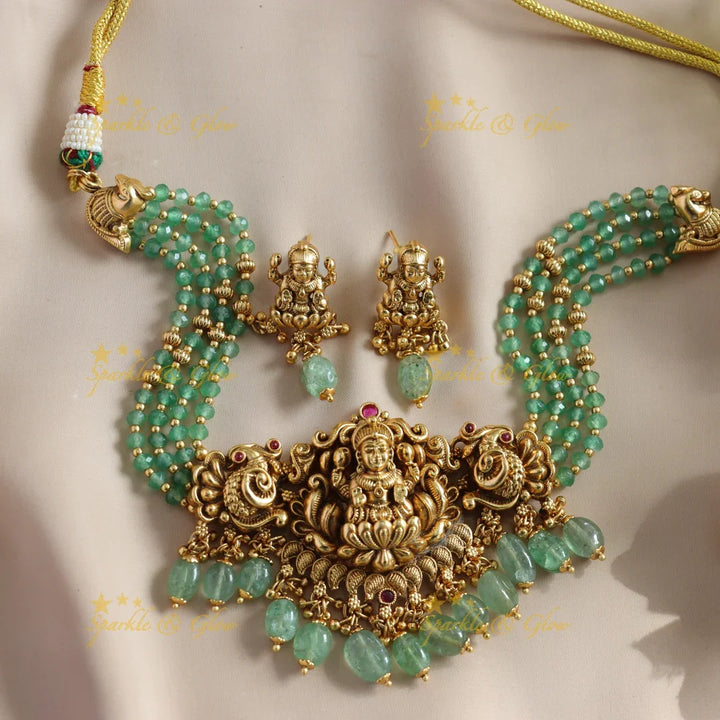 Beautiful Lakshmi Peacock carved choker with multi layer gold and mint green beads - Sparkle and Glow