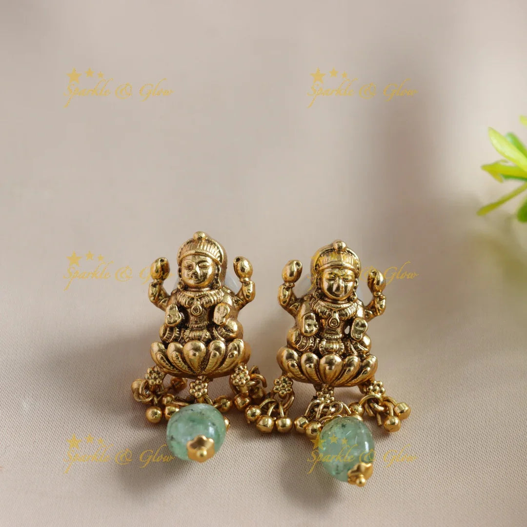 Beautiful Lakshmi Peacock carved choker with multi layer gold and mint green beads - Sparkle and Glow