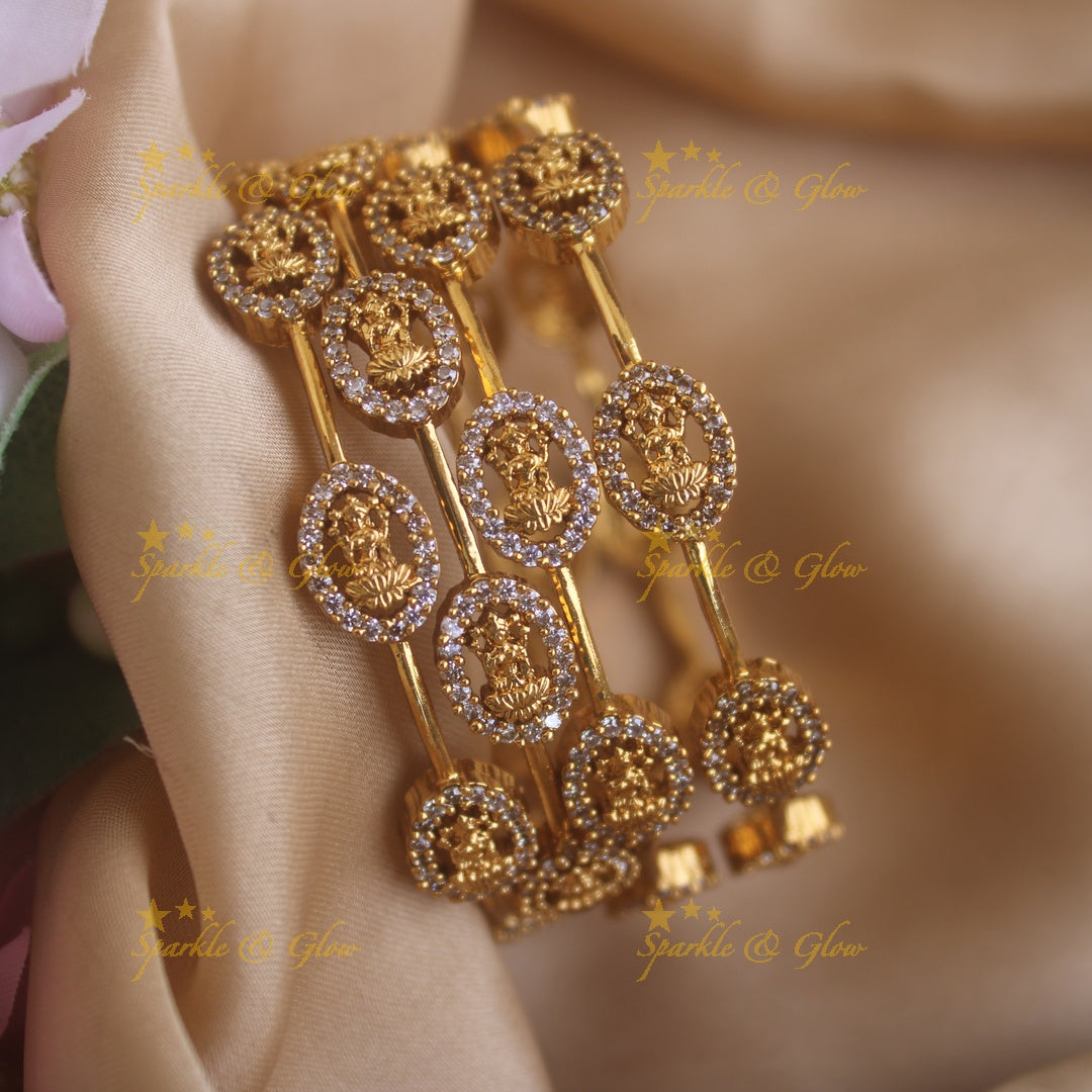 Beautiful Lakshmi carved oval design bangles with stones, two pairs , 2.4