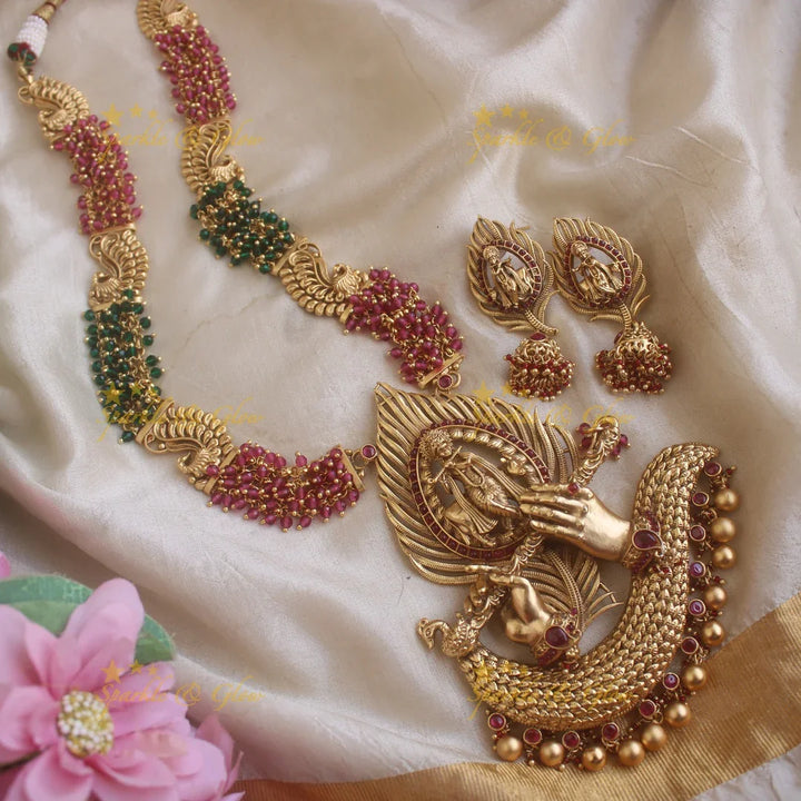 Grand Krishna peacock feather and flute carved pendant haram with cluster red and green beads - Sparkle and Glow