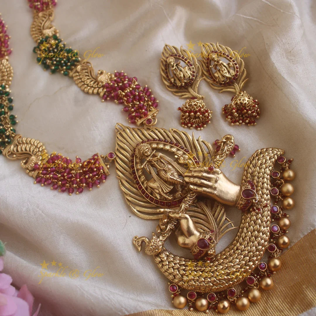 Grand Krishna peacock feather and flute carved pendant haram with cluster red and green beads - Sparkle and Glow