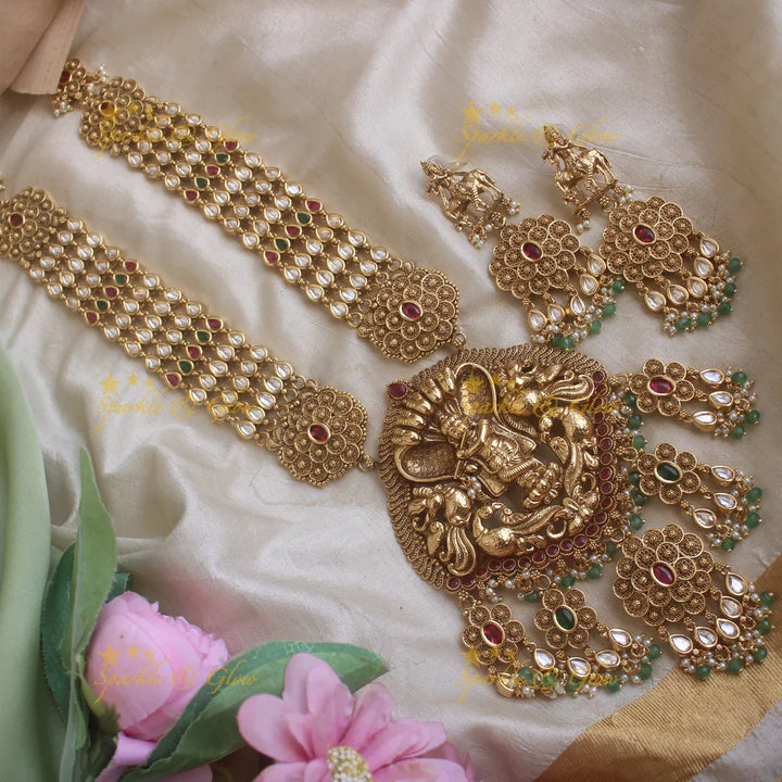 Beautiful Krishna playing flute and floral design kundan haram with pearls and green beads - Sparkle and Glow