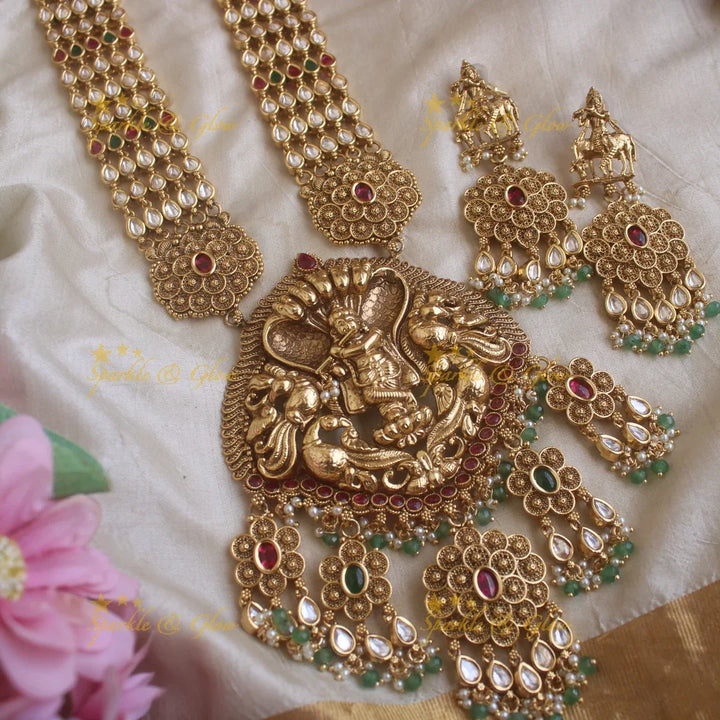Beautiful Krishna playing flute and floral design kundan haram with pearls and green beads - Sparkle and Glow