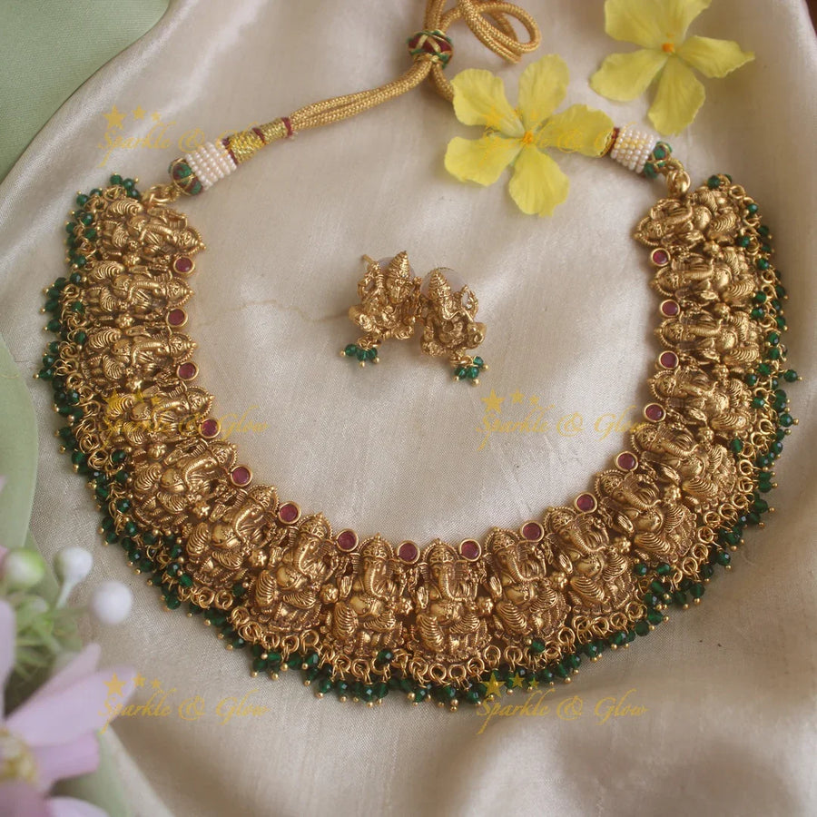 Elegant Ganesha carved short necklace with ruby stones and green beads - Sparkle and Glow