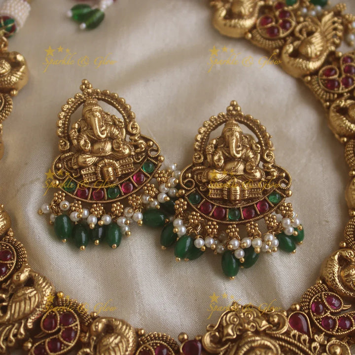 Grand Intricate Ganesha peacock carved short necklace with ruby emerald stones pearls and green beads - Sparkle and Glow