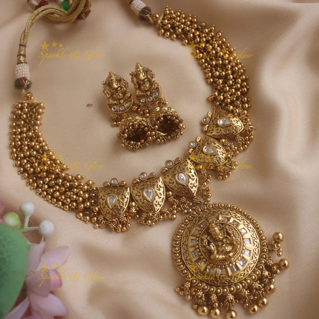 Stunning Ganesha carved pendant leaf design cluster gold short necklace with gold beads - Sparkle and Glow