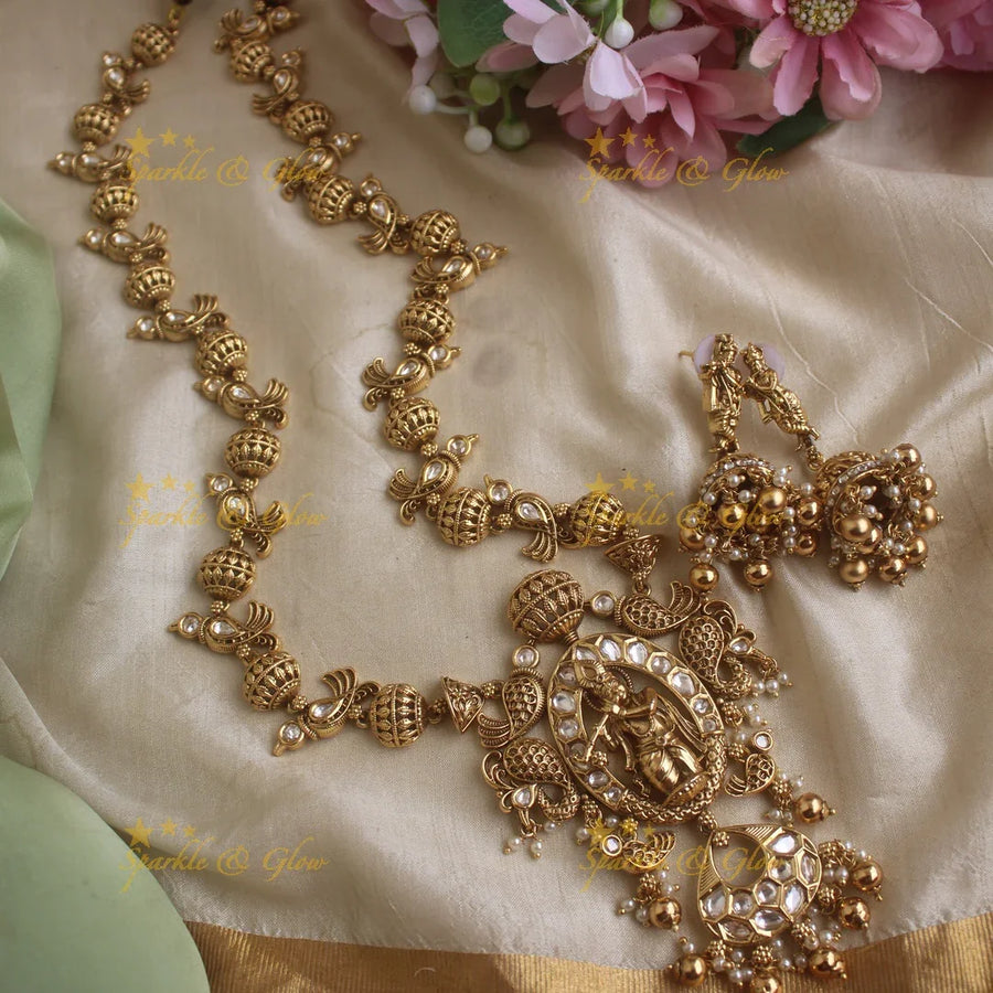 Elegant Krishna playing flute and parrot design long necklace with pearls and gold beads - Sparkle and Glow