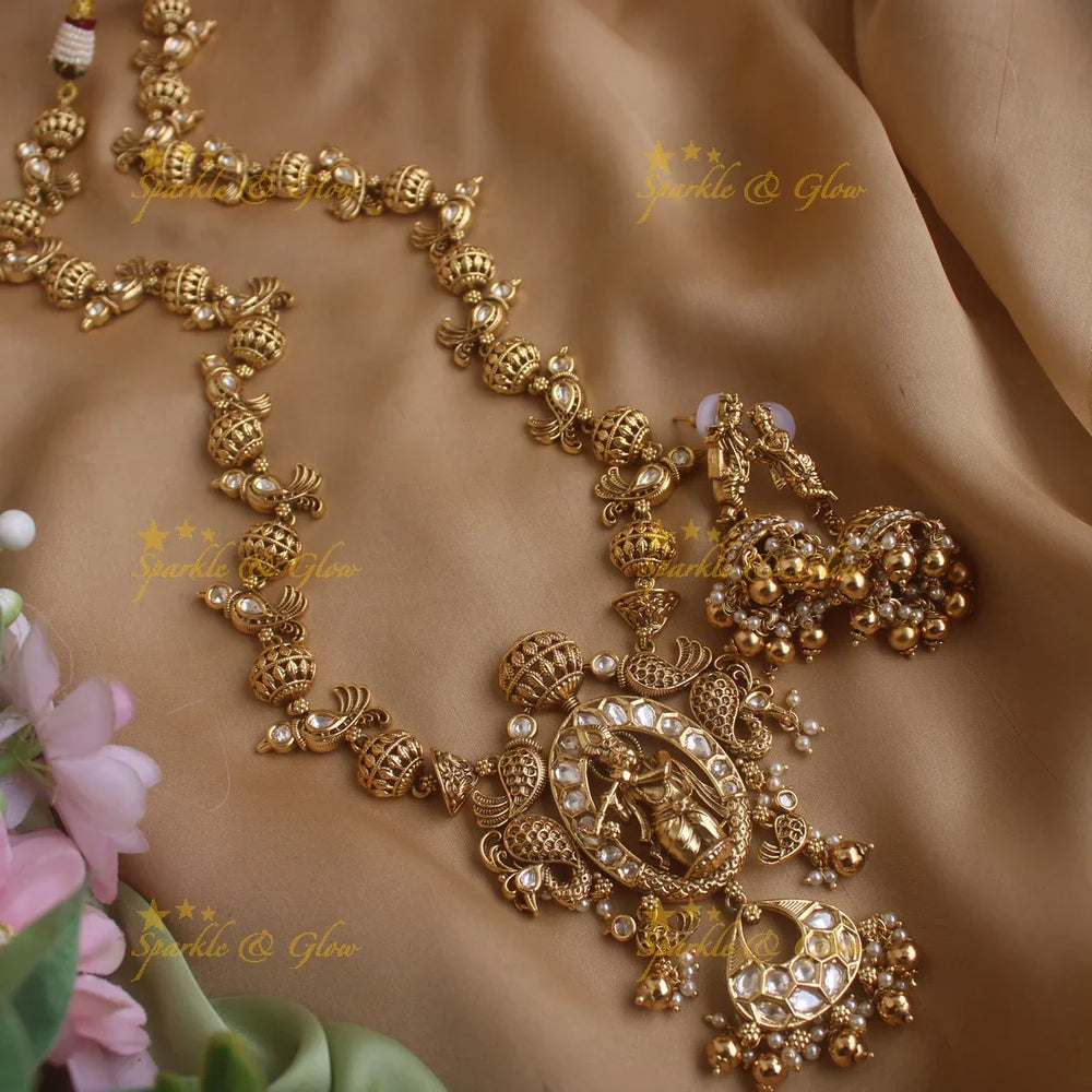 Elegant Krishna playing flute and parrot design long necklace with pearls and gold beads - Sparkle and Glow