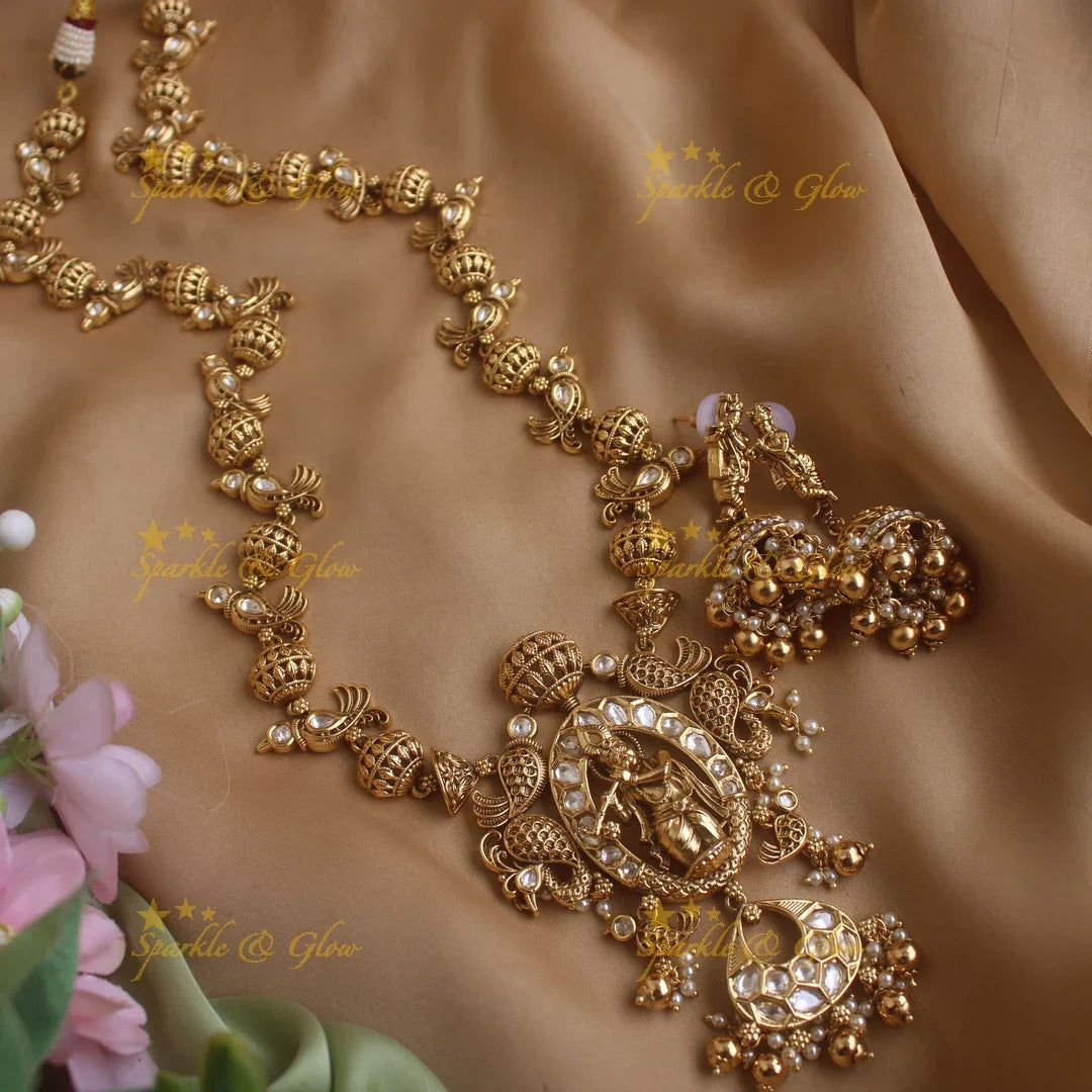 Elegant Krishna playing flute and parrot design long necklace with pearls and gold beads - Sparkle and Glow