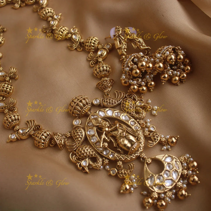 Elegant Krishna playing flute and parrot design long necklace with pearls and gold beads - Sparkle and Glow