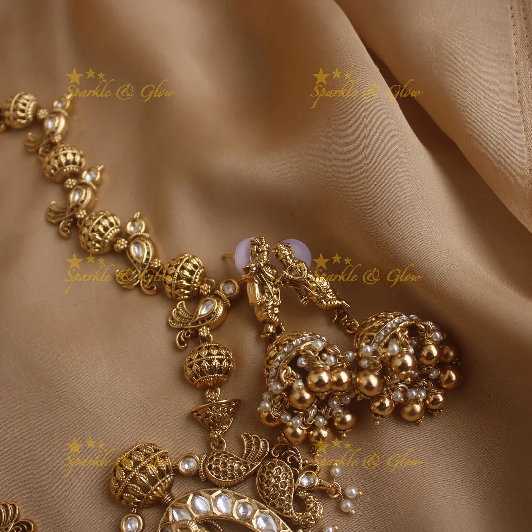 Elegant Krishna playing flute and parrot design long necklace with pearls and gold beads - Sparkle and Glow