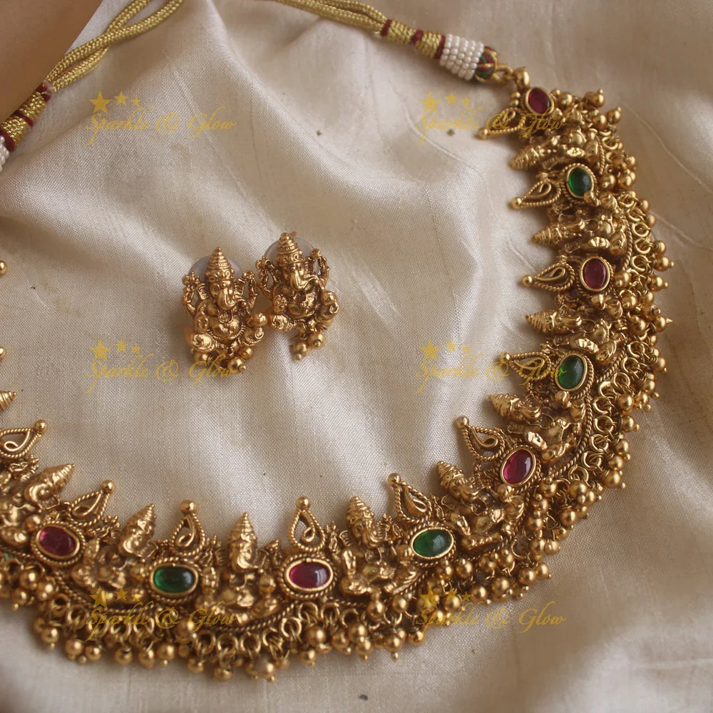 Elegant Idol Ganesha and Leaf design short necklace with gold beads - Sparkle and Glow