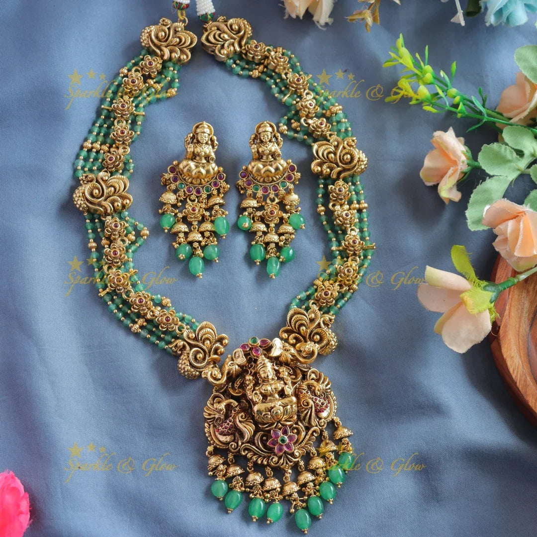 Elegant Lakshmi peacock floral design haram with multi layer gold and mint green beads - Sparkle and Glow