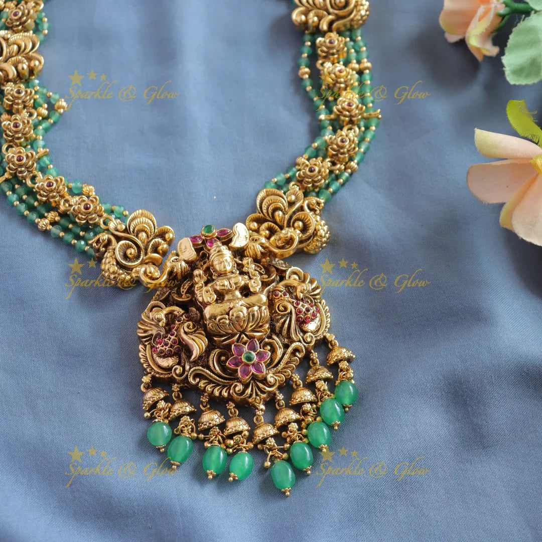 Elegant Lakshmi peacock floral design haram with multi layer gold and mint green beads - Sparkle and Glow
