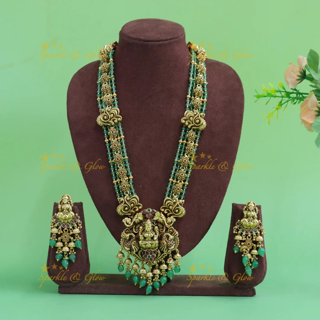 Elegant Lakshmi peacock floral design haram with multi layer gold and mint green beads - Sparkle and Glow