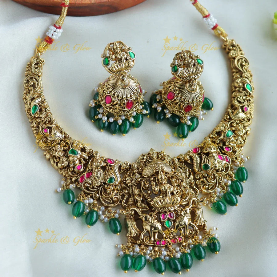 Beautiful Lakshmi Elephant peacock carved jadau short necklace with green beads - Sparkle and Glow