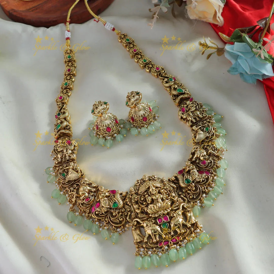 Exquisite Lakshmi Elephant peacock carved jadau long necklace with mint green beads - Sparkle and Glow