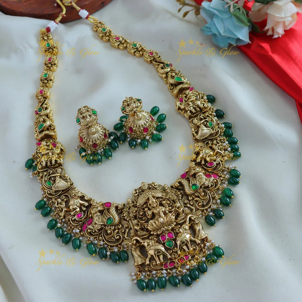 Exquisite Lakshmi Elephant peacock carved jadau long necklace with mint green beads - Sparkle and Glow