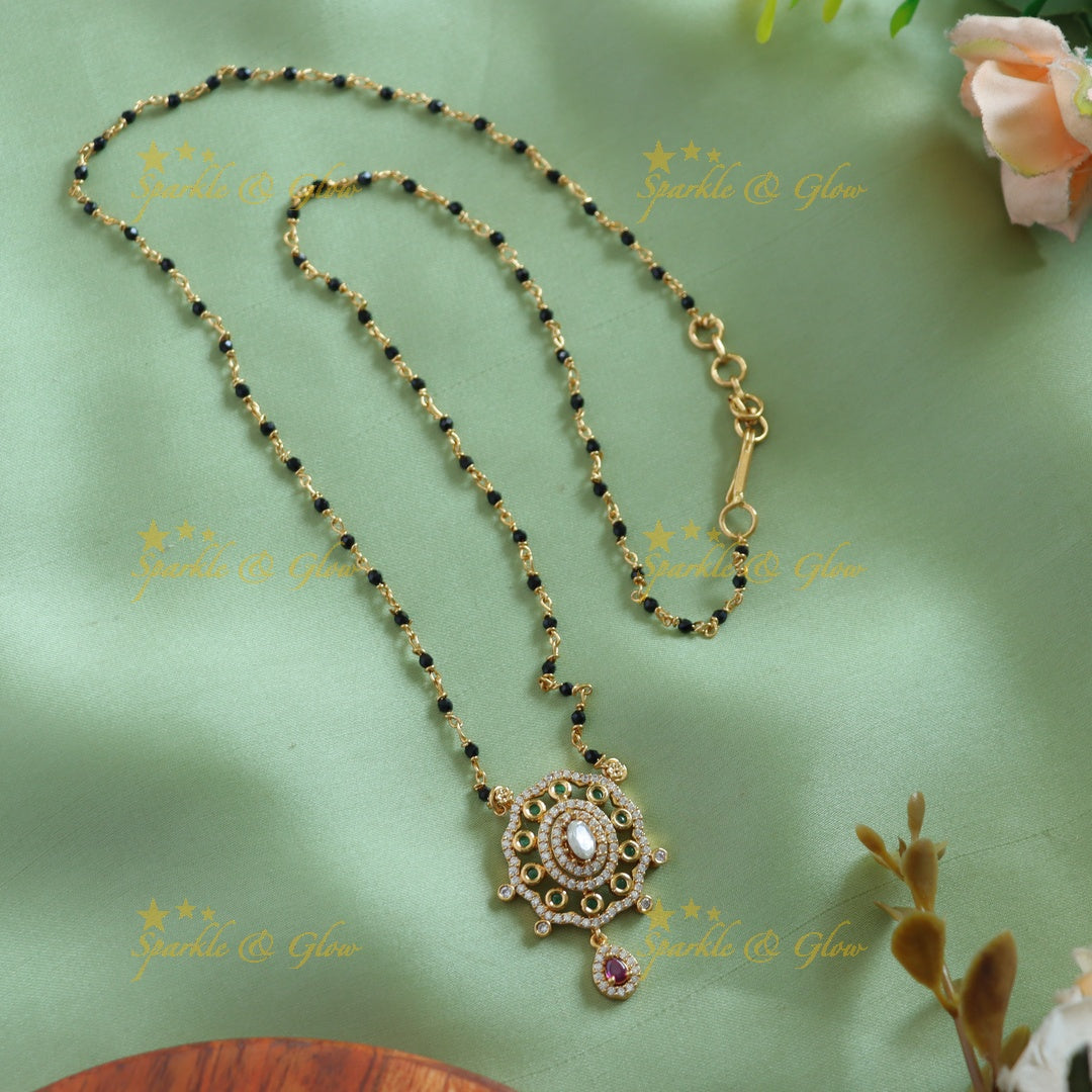 Gold alike Floral oval design stone pendant black beads chain , mangalsutra