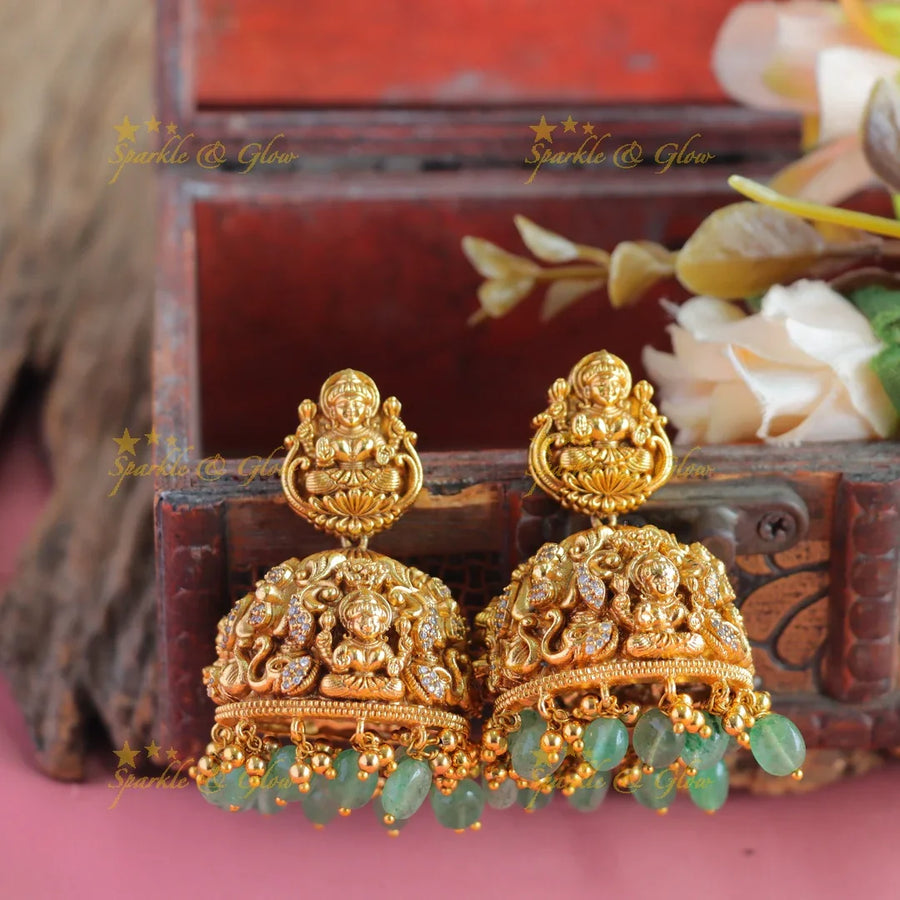 Elegant Idol Mahalakshmi Floral carved Antique jhumukas with mintgreen beads - Sparkle and Glow