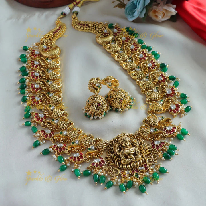 Exclusive Lakshmi peacock carved kemp stone long necklace with pearls and green beads - Sparkle and Glow