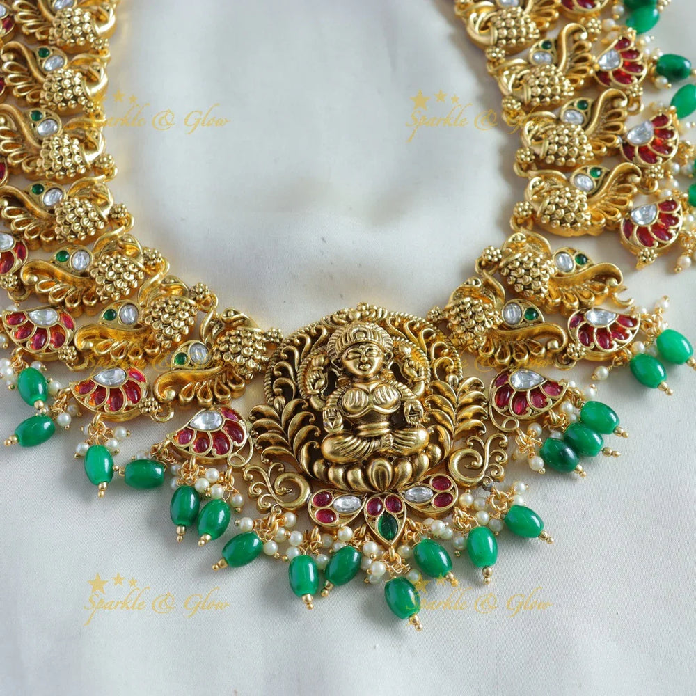 Exclusive Lakshmi peacock carved kemp stone long necklace with pearls and green beads - Sparkle and Glow