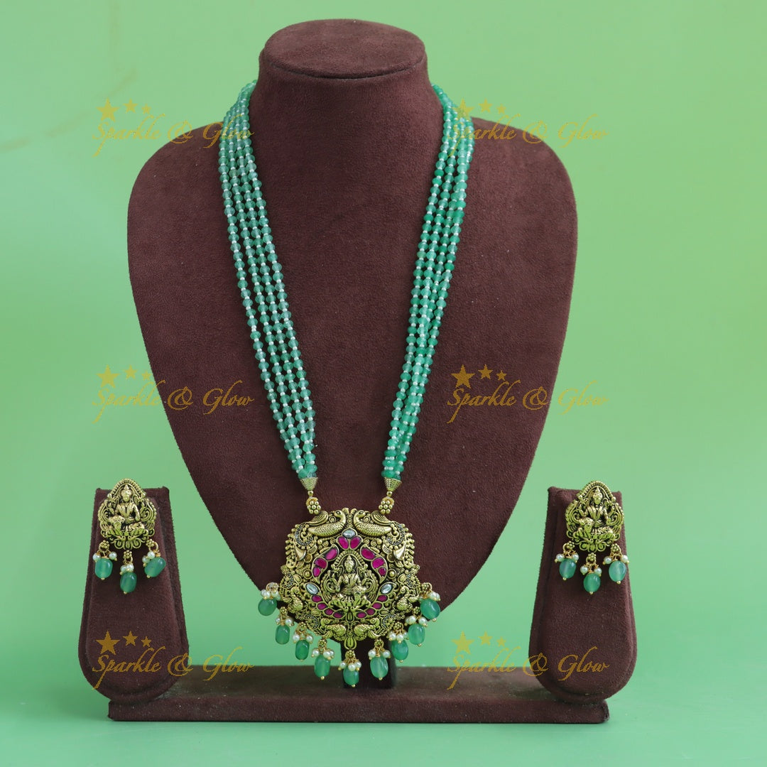 Beautiful Lakshmi peacock carved pendant haram with multi layer mint green beads chain