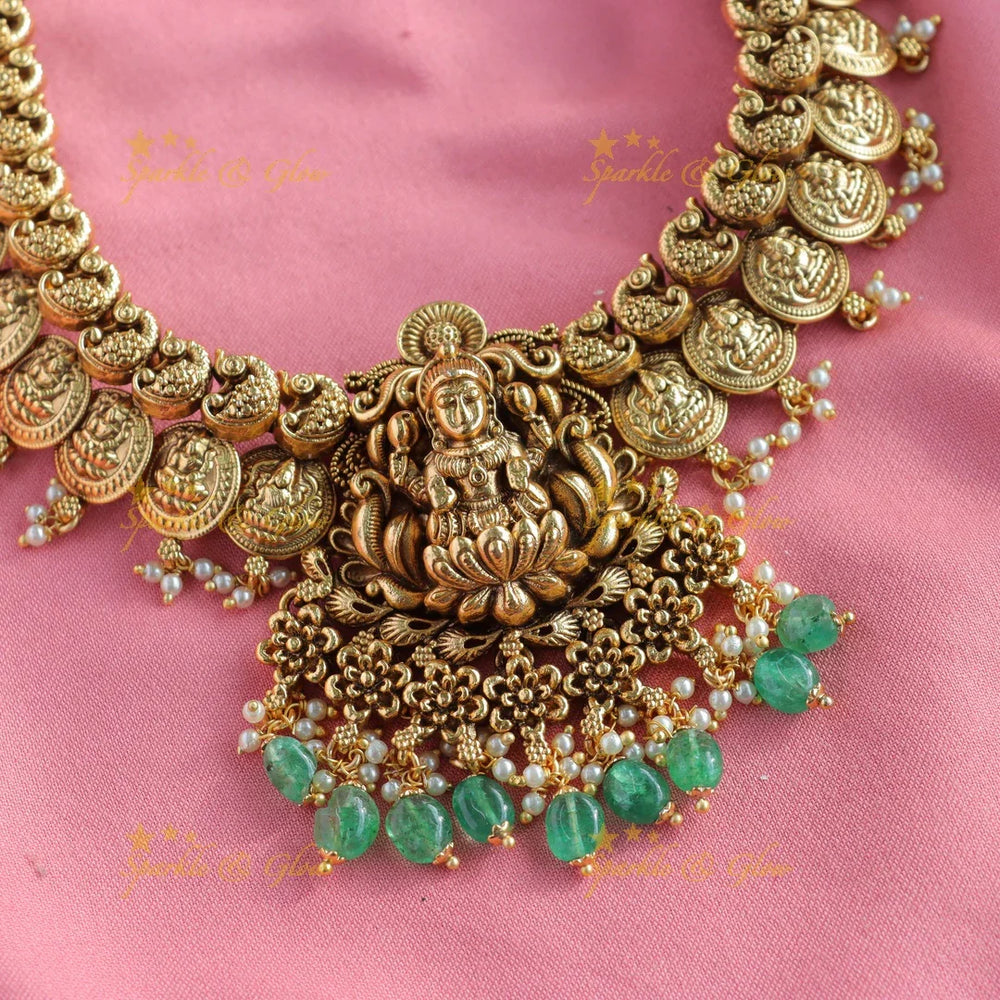 Beautiful Peacock Lakshmi coin long necklace with pearls and mint green beads - Sparkle and Glow
