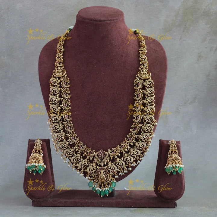 Grand intricate Lakshmi peacock carved long necklace with ruby emerald pearls and green beads - Sparkle and Glow
