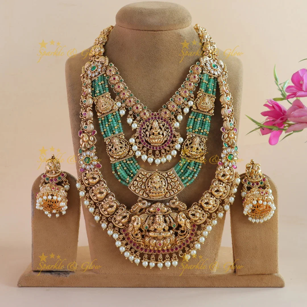 Grand Bridal Lakshmi peacock carved three layer haram with ruby emerald pearls and multi layer mint green beads - Sparkle and Glow