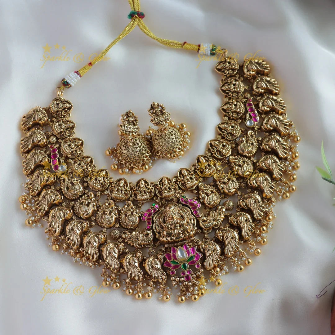 Grand bridal Lakshmi peacock carved lotus jadau short necklace with pearls and gold beads - Sparkle and Glow