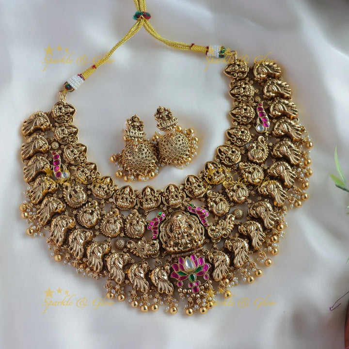 Grand bridal Lakshmi peacock carved lotus jadau short necklace with pearls and gold beads - Sparkle and Glow