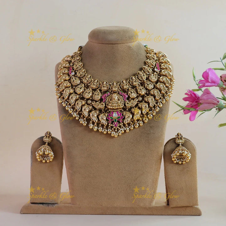 Grand bridal Lakshmi peacock carved lotus jadau short necklace with pearls and gold beads - Sparkle and Glow