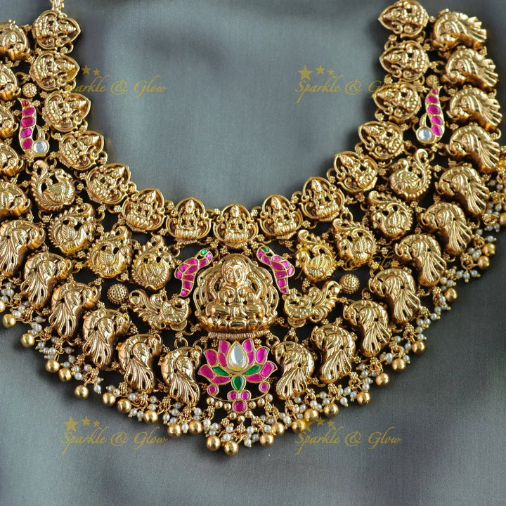 Grand bridal Lakshmi peacock carved lotus jadau short necklace with pearls and gold beads - Sparkle and Glow