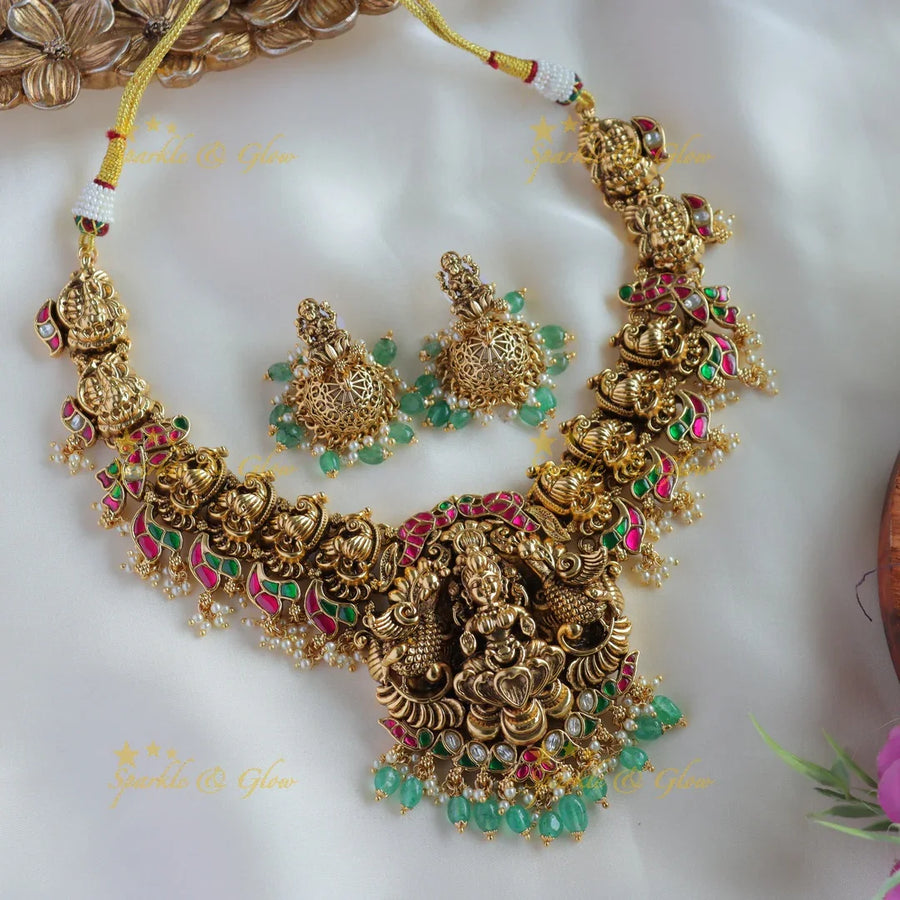 Gorgeous Lakshmi peacock carved jadau short necklace with pearls and mint green beads - Sparkle and Glow