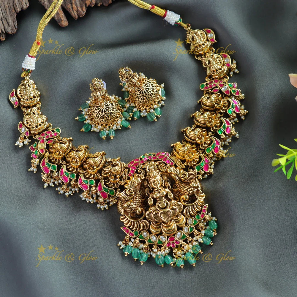 Gorgeous Lakshmi peacock carved jadau short necklace with pearls and mint green beads - Sparkle and Glow