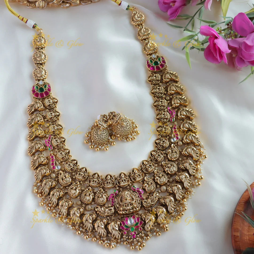 Grand bridal Lakshmi peacock carved lotus jadau long necklace with pearls and gold beads - Sparkle and Glow