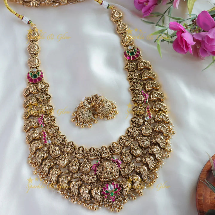 Grand bridal Lakshmi peacock carved lotus jadau long necklace with pearls and gold beads - Sparkle and Glow