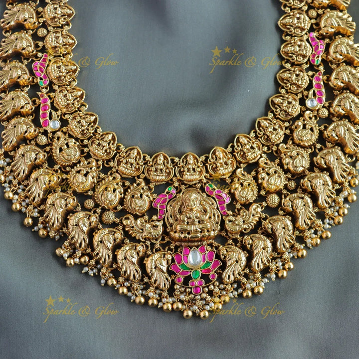 Grand bridal Lakshmi peacock carved lotus jadau long necklace with pearls and gold beads - Sparkle and Glow