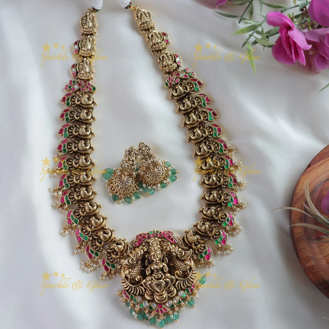 Exclusive Lakshmi peacock carved jadau long necklace with pearls and mint green beads - Sparkle and Glow