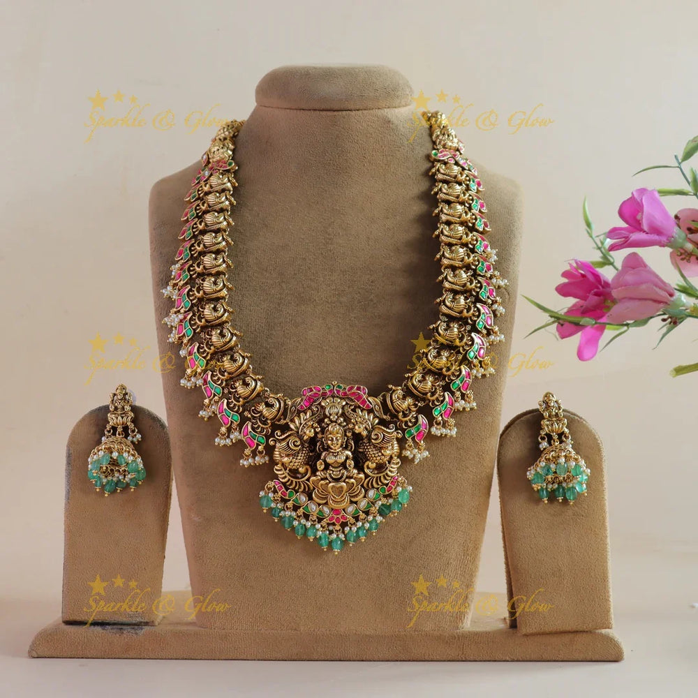 Exclusive Lakshmi peacock carved jadau long necklace with pearls and mint green beads - Sparkle and Glow