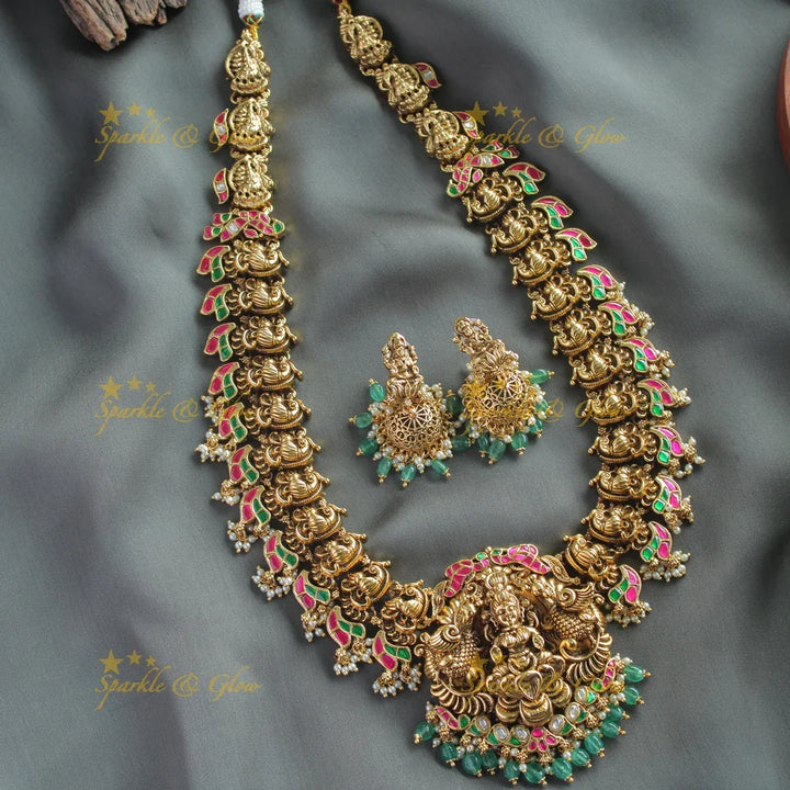 Exclusive Lakshmi peacock carved jadau long necklace with pearls and mint green beads - Sparkle and Glow