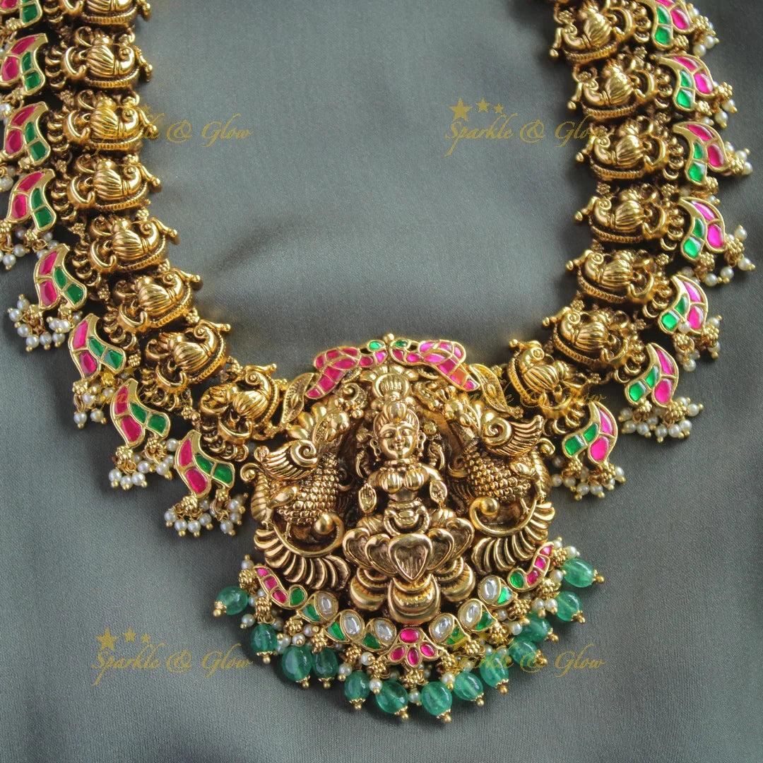Exclusive Lakshmi peacock carved jadau long necklace with pearls and mint green beads - Sparkle and Glow
