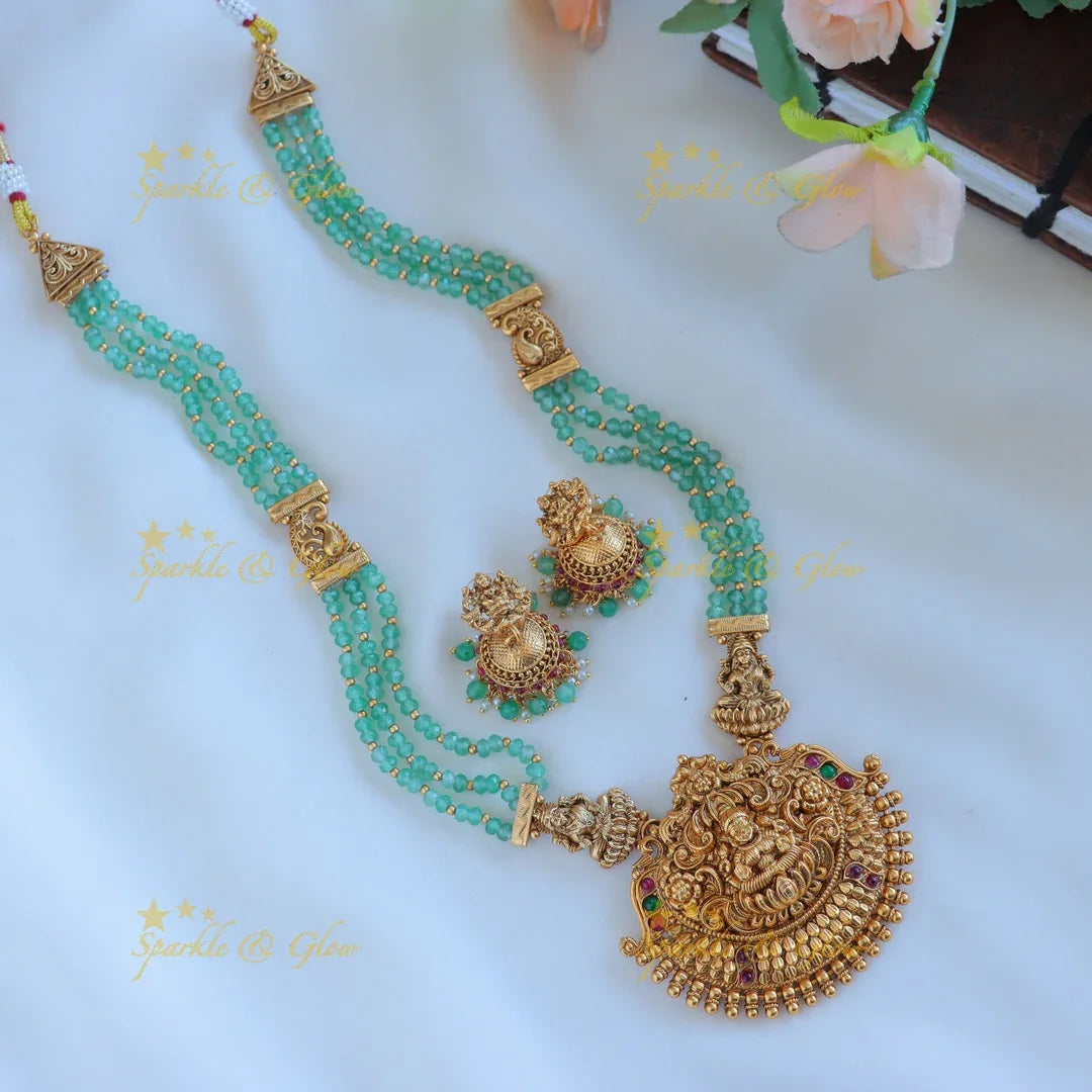 Grand Idol Lakshmi Peacock pendant Haram with three layered mintgreen beads - Sparkle and Glow