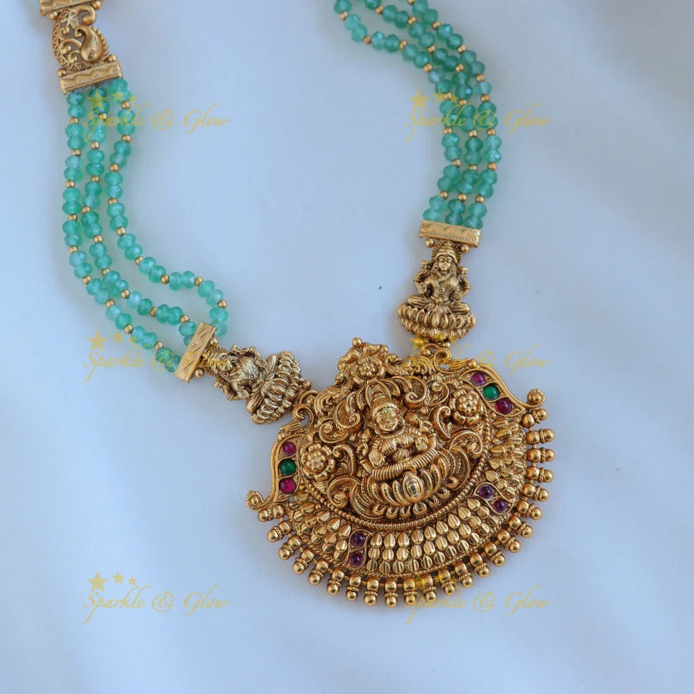 Grand Idol Lakshmi Peacock pendant Haram with three layered mintgreen beads - Sparkle and Glow