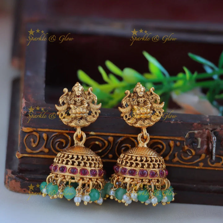 Grand Idol Lakshmi Peacock pendant Haram with three layered mintgreen beads - Sparkle and Glow